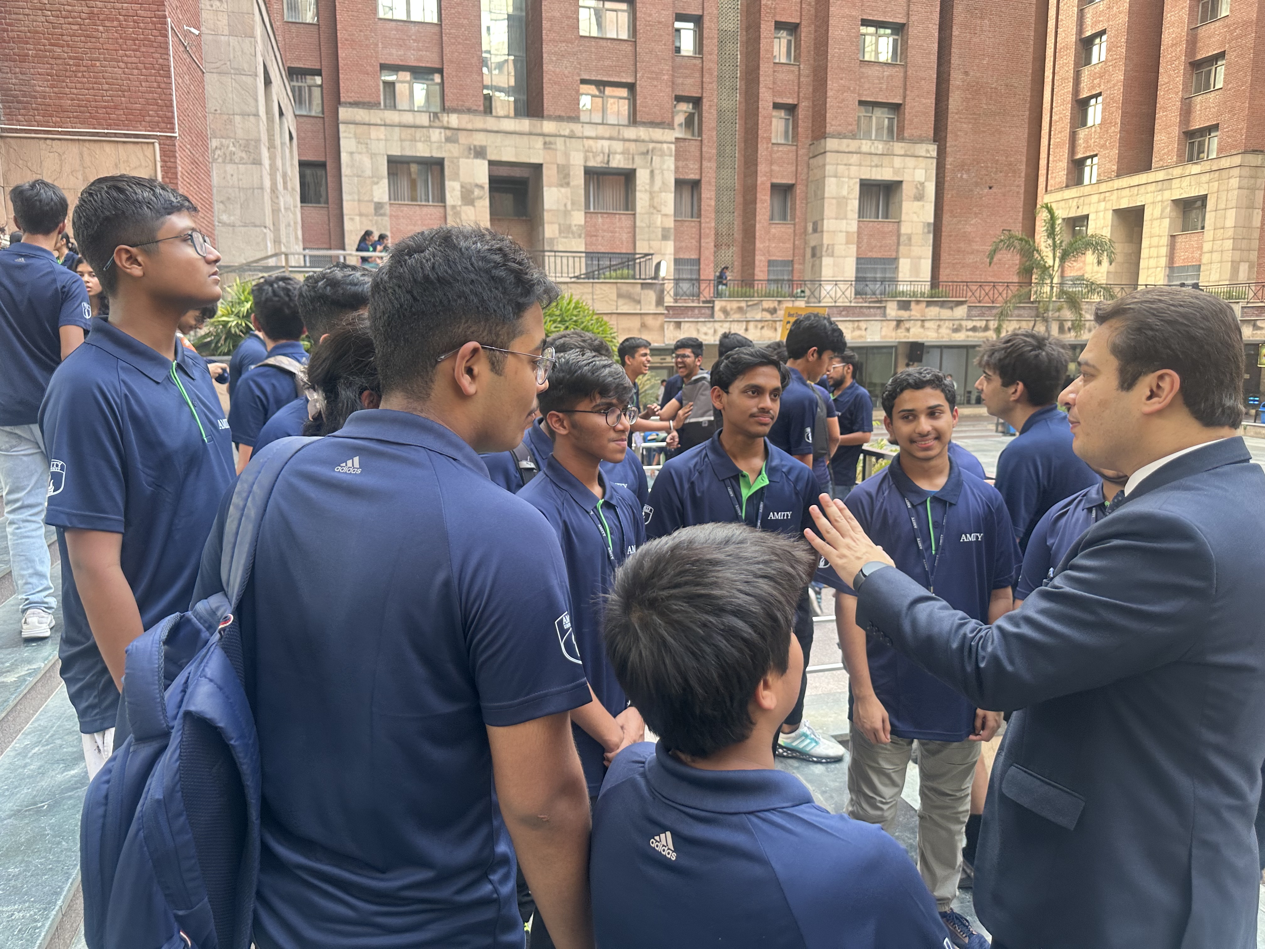 In conversation with students in the courtyard